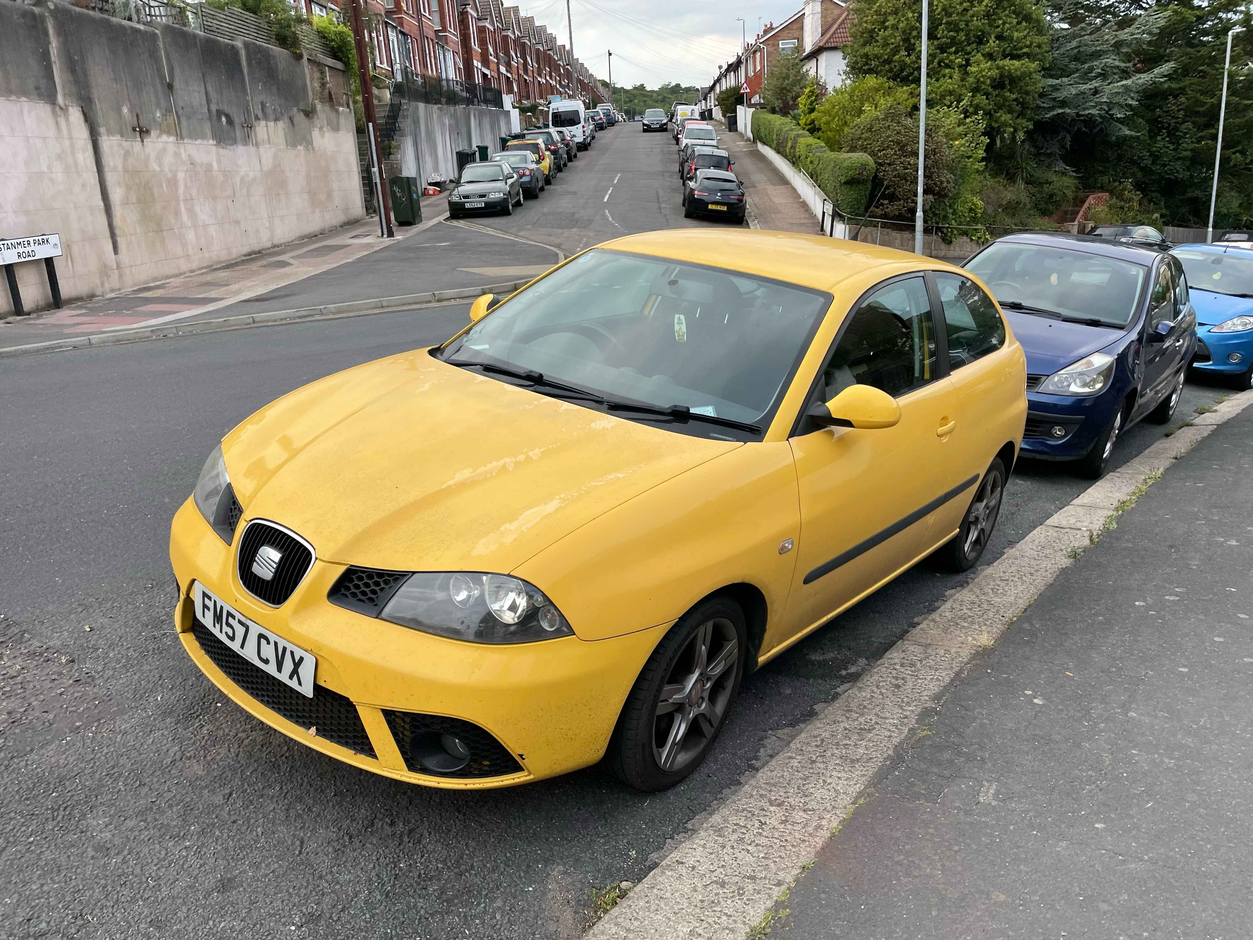 Photograph of FM57 CVX - a Yellow Seat Ibiza parked in Hollingdean by a non-resident. The first of two photographs supplied by the residents of Hollingdean.