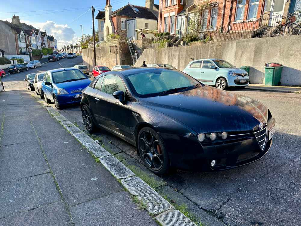Photograph of SL09 WUB - a Black Alfa Romeo Brera parked in Hollingdean by a non-resident. The eleventh of twenty-six photographs supplied by the residents of Hollingdean.
