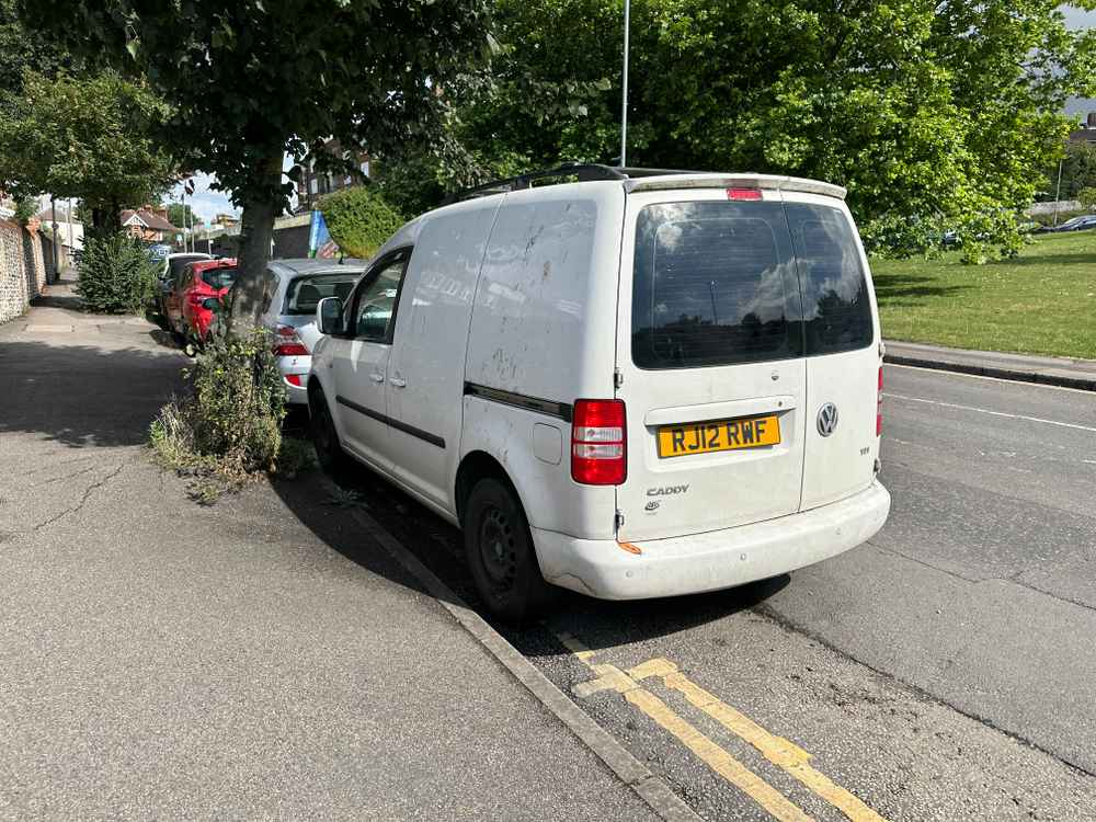 Photograph of RJ12 RWF - a White Volkswagen Caddy parked in Hollingdean by a non-resident. The second of two photographs supplied by the residents of Hollingdean.