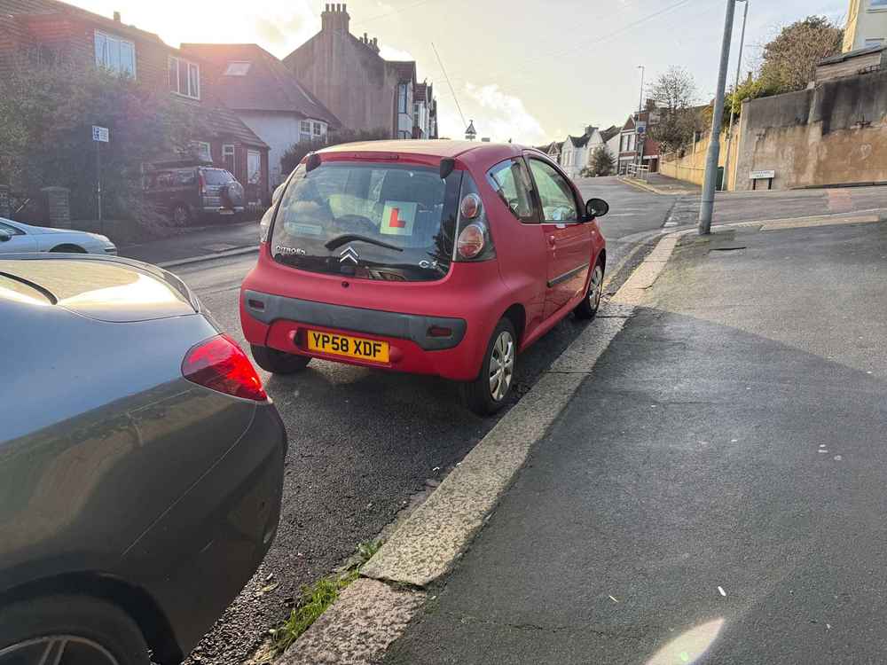 Photograph of YP58 XDF - a Red Citroen C1 parked in Hollingdean by a non-resident, and potentially abandoned. The twenty-first of twenty-one photographs supplied by the residents of Hollingdean.