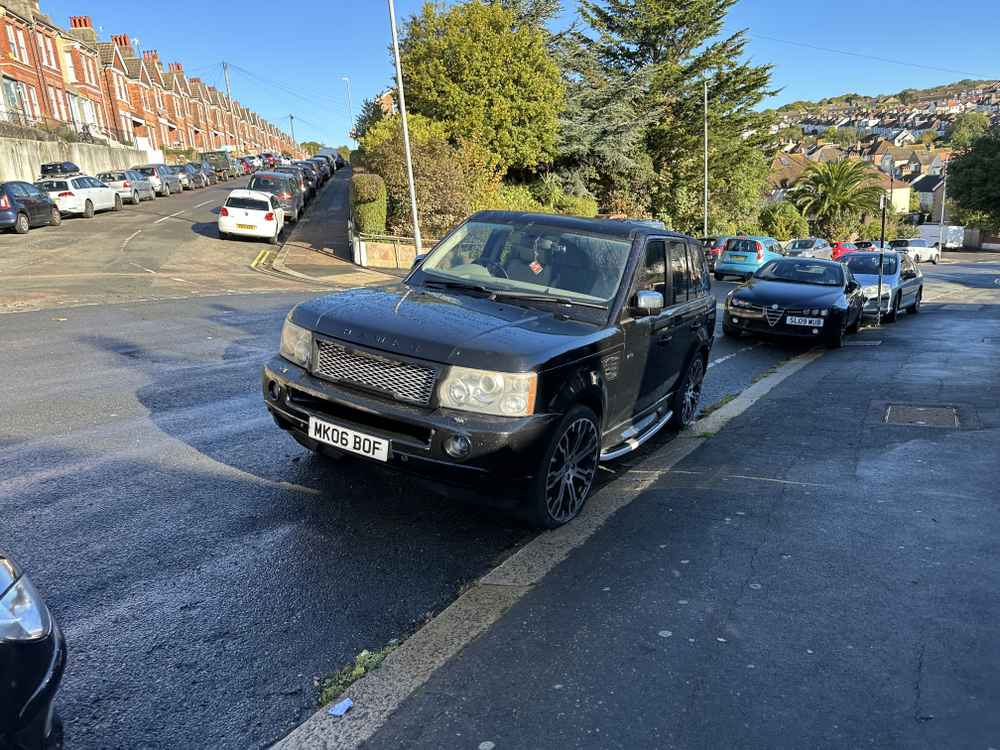 Photograph of MK06 BOF - a Black Land Rover Ranger Rover parked in Hollingdean by a non-resident. The first of four photographs supplied by the residents of Hollingdean.