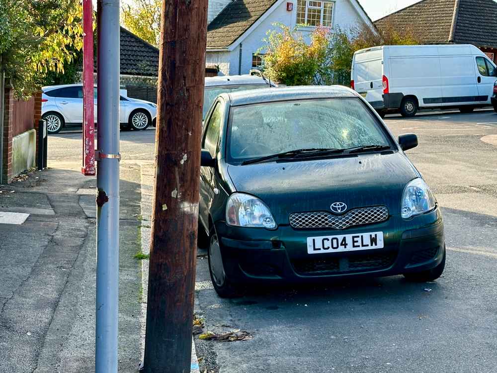 Photograph of LC04 ELW - a Green Toyota Yaris parked in Hollingdean by a non-resident. The eighth of twelve photographs supplied by the residents of Hollingdean.