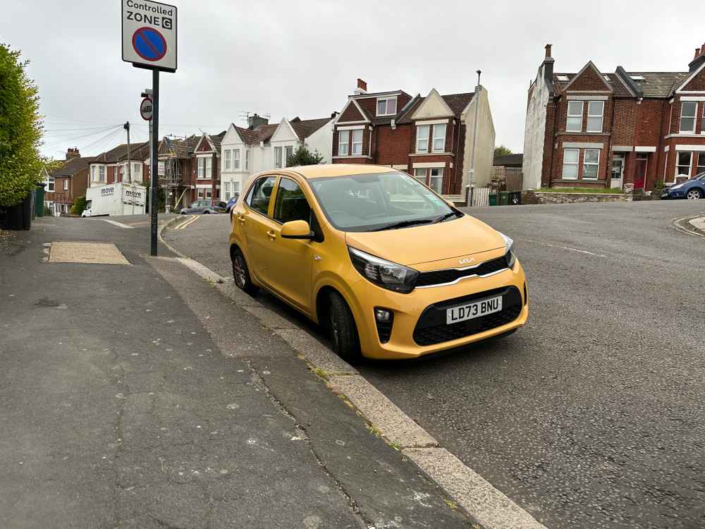 Photograph of LD73 BNU - a Yellow Kia Picanto parked in Hollingdean by a non-resident. The third of four photographs supplied by the residents of Hollingdean.