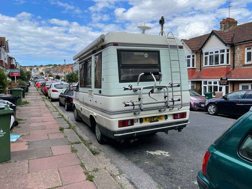 Photograph of R384 ORC - a Beige Volkswagen Transporter camper van parked in Hollingdean by a non-resident, and potentially abandoned. The third of fifteen photographs supplied by the residents of Hollingdean.