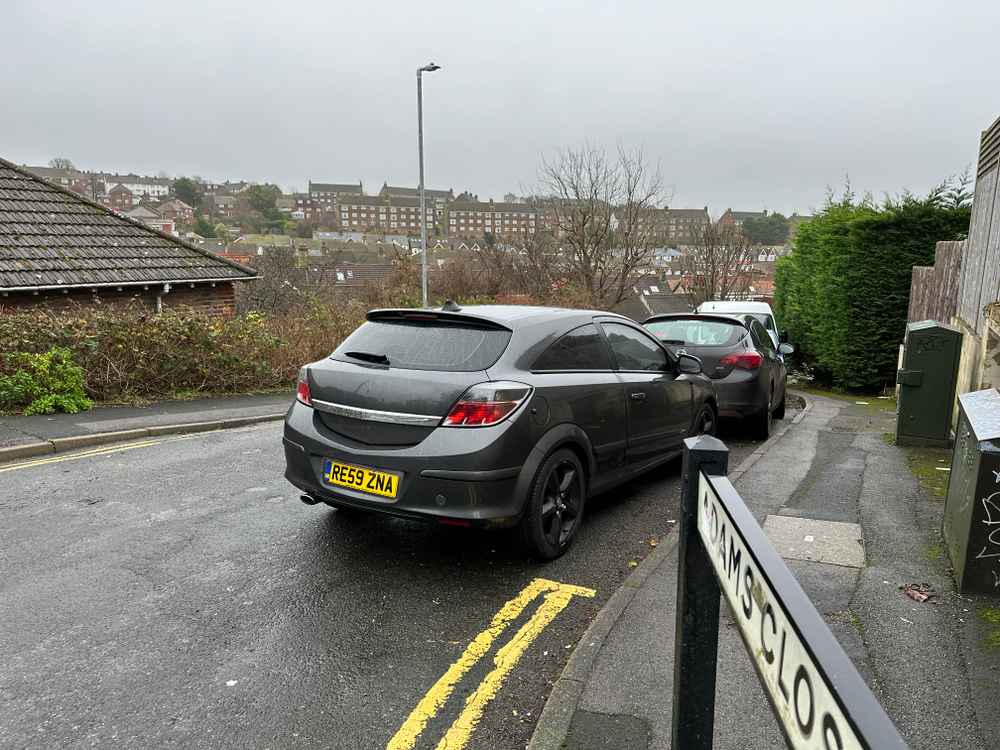 Photograph of RE59 ZNA - a Grey Vauxhall Astra parked in Hollingdean by a non-resident. The second of eight photographs supplied by the residents of Hollingdean.