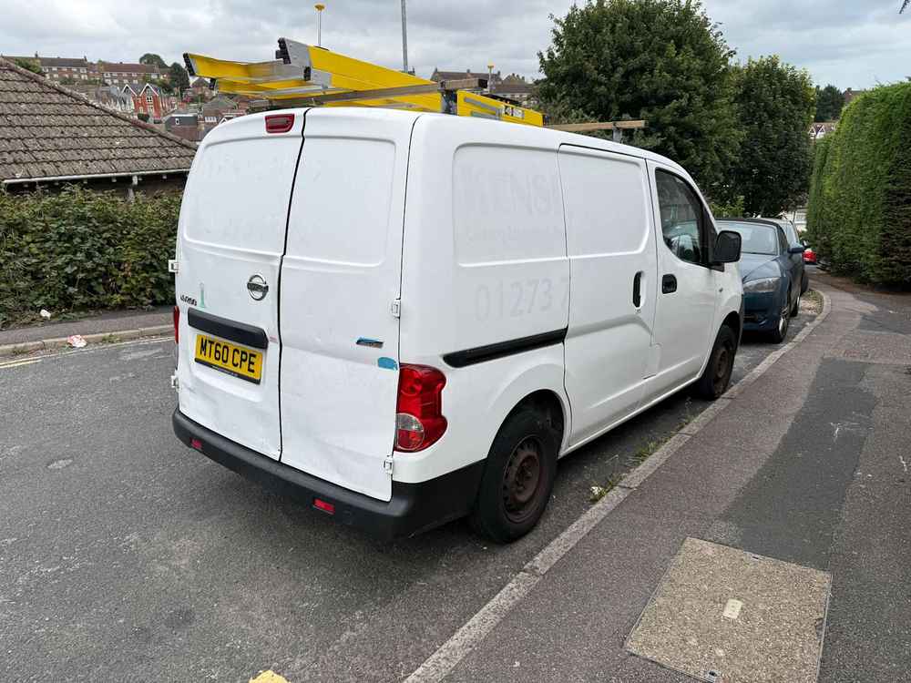 Photograph of MT60 CPE - a White Nissan NV200 parked in Hollingdean by a non-resident, and potentially abandoned. The ninth of fourteen photographs supplied by the residents of Hollingdean.