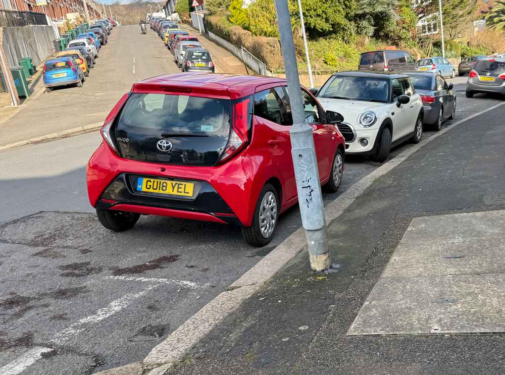 Photograph of GU18 YEL - a Red Toyota Aygo parked in Hollingdean by a non-resident. The first of five photographs supplied by the residents of Hollingdean.