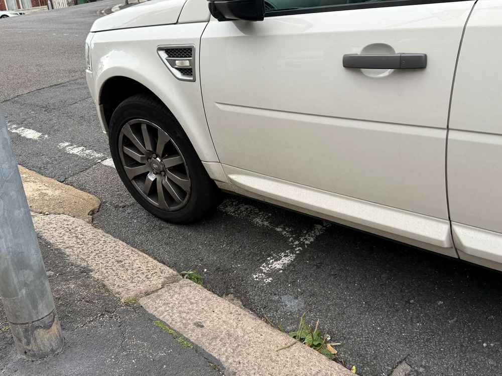 Photograph of AK10 VGZ - a White Land Rover Freelander parked in Hollingdean by a non-resident. The ninth of thirteen photographs supplied by the residents of Hollingdean.