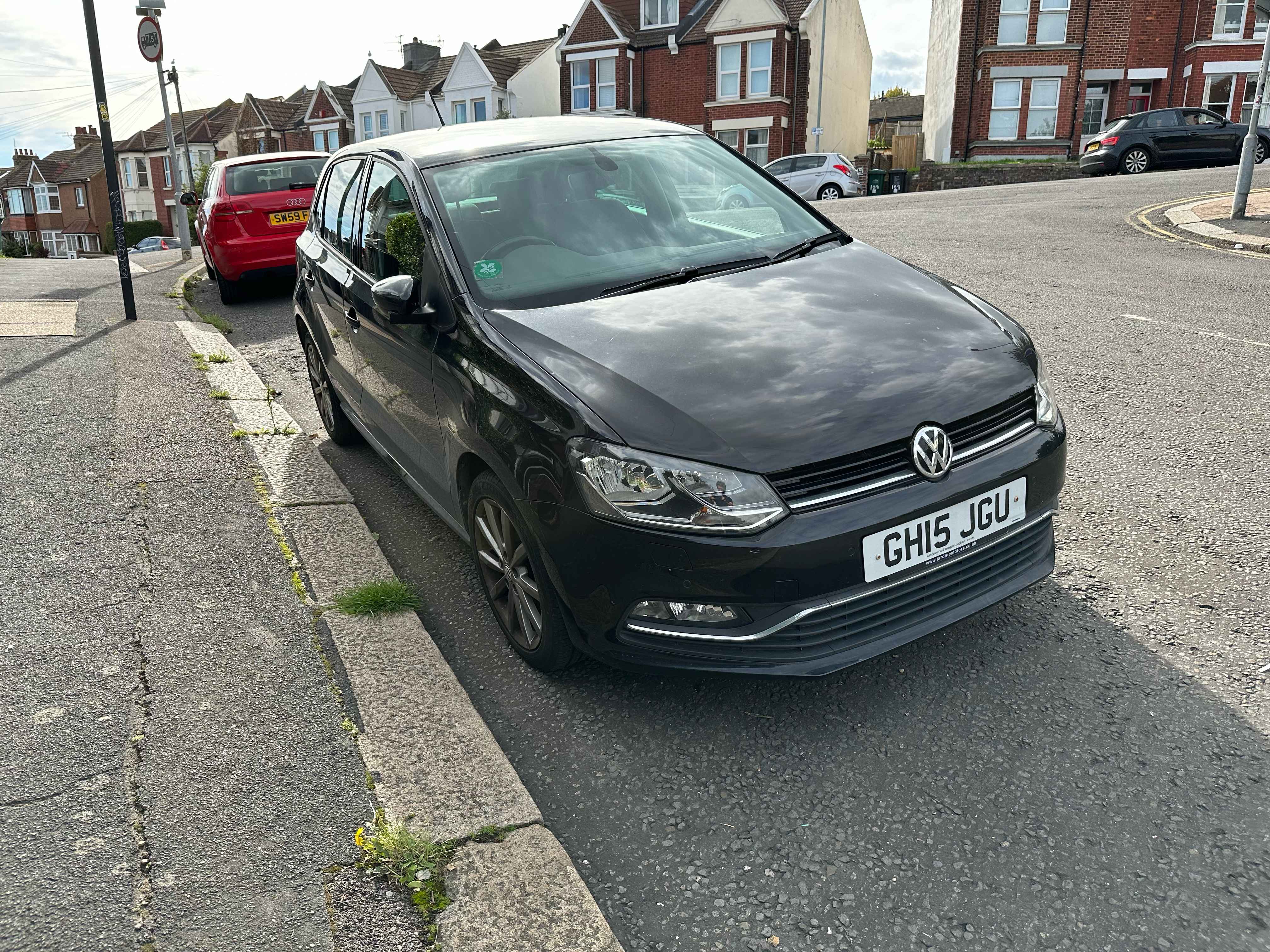Photograph of GH15 JGU - a Black Volkswagen Polo parked in Hollingdean by a non-resident. The first of three photographs supplied by the residents of Hollingdean.