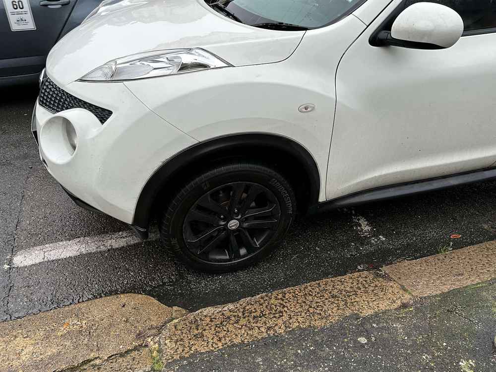 Photograph of RF12 JVH - a White Nissan Juke parked in Hollingdean by a non-resident who uses the local area as part of their Brighton commute. The third of twenty-five photographs supplied by the residents of Hollingdean.