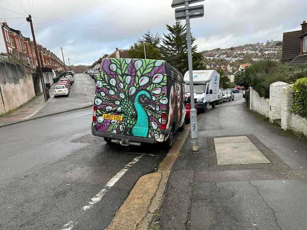 Photograph of LR07 CZU - a White Ford Transit parked in Hollingdean by a non-resident. The second of two photographs supplied by the residents of Hollingdean.