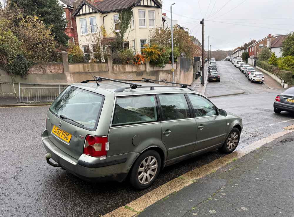 Photograph of SJ52 FUG - a Green Volkswagen Passat parked in Hollingdean by a non-resident, and potentially abandoned. The first of two photographs supplied by the residents of Hollingdean.