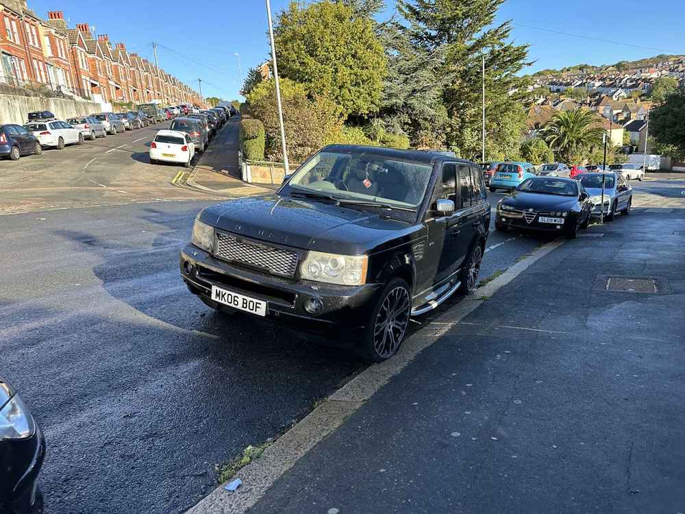 Photograph of MK06 BOF - a Black Land Rover Ranger Rover parked in Hollingdean by a non-resident. The first of four photographs supplied by the residents of Hollingdean.