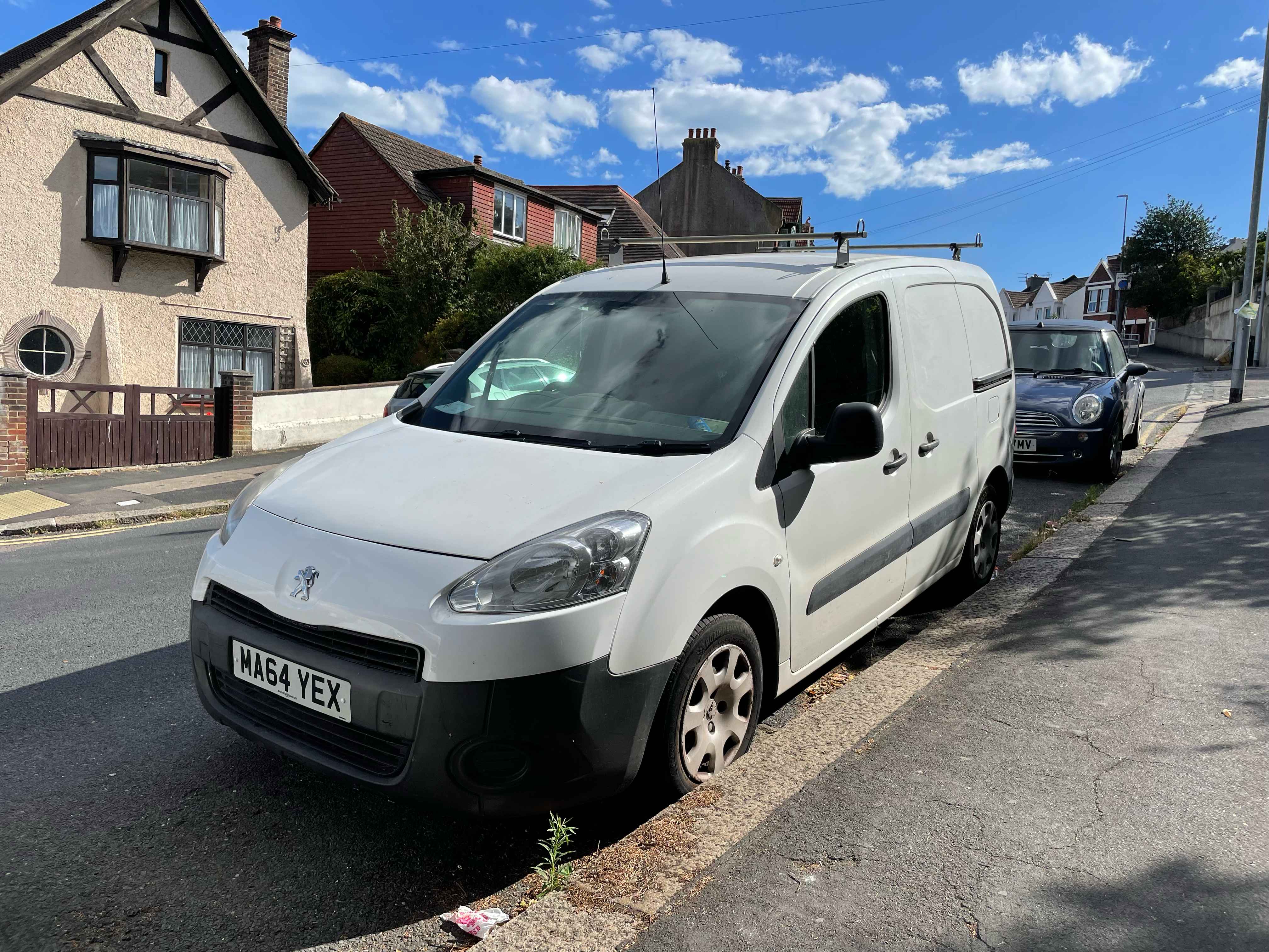 Photograph of MA64 YEX - a White Peugeot Partner parked in Hollingdean by a non-resident. The first of six photographs supplied by the residents of Hollingdean.