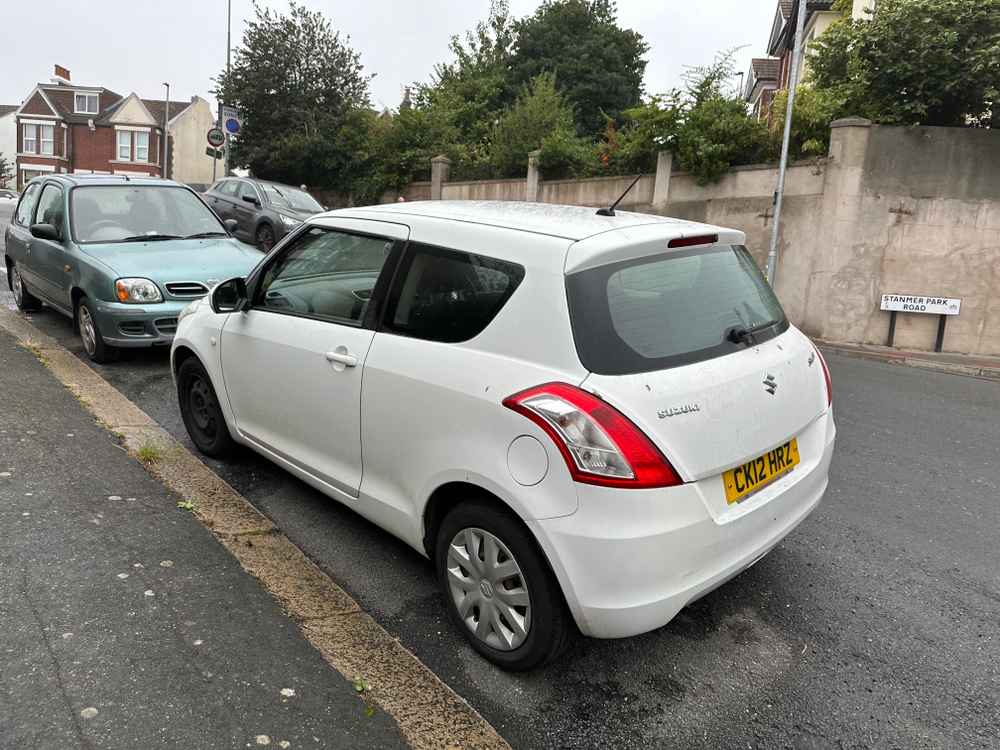 Photograph of CK12 HRZ - a White Suzuki Swift parked in Hollingdean by a non-resident. The fifth of five photographs supplied by the residents of Hollingdean.