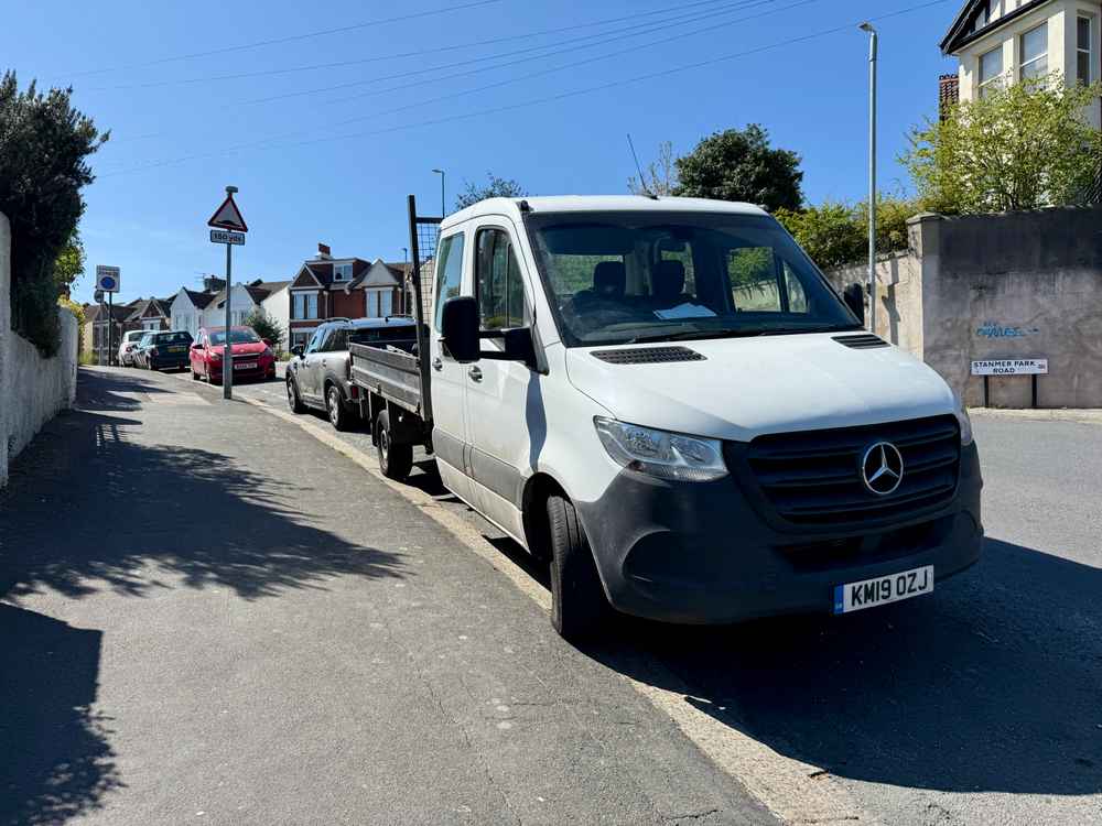 Photograph of KM19 OZJ - a White Mercedes Sprinter parked in Hollingdean by a non-resident. 