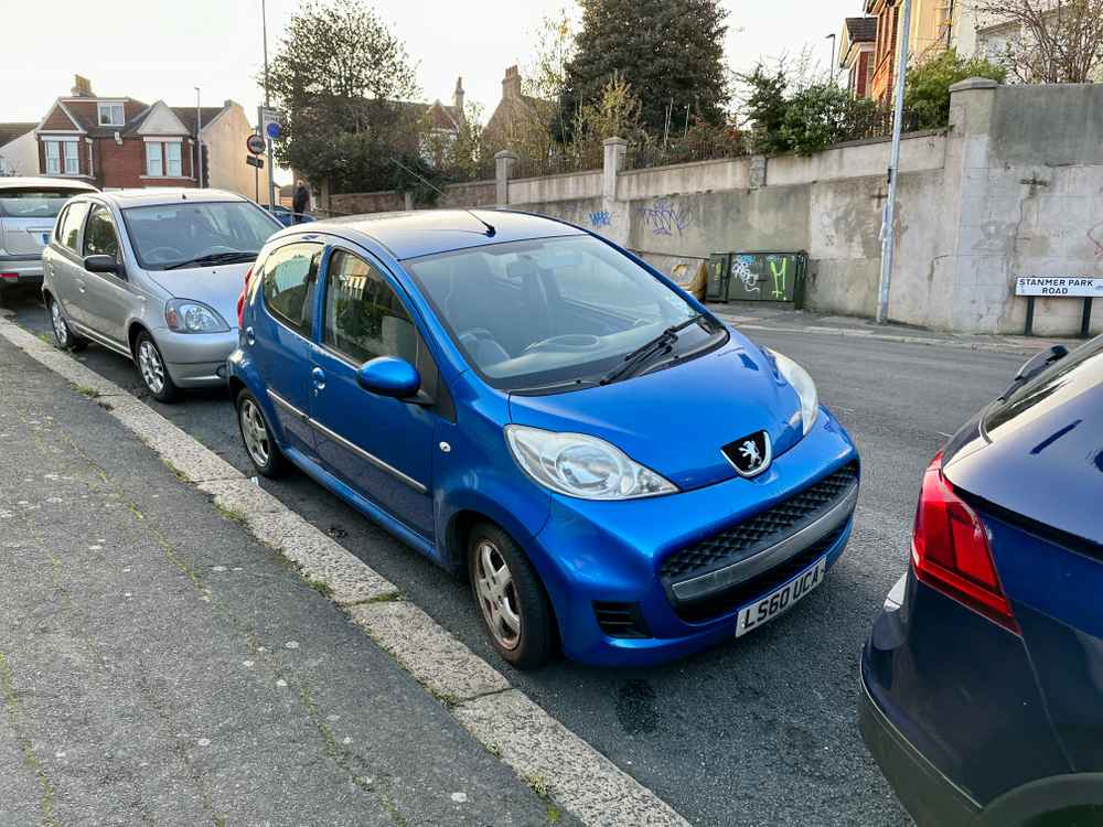 Photograph of LS60 UCA - a Blue Peugeot 107 parked in Hollingdean by a non-resident. The sixth of thirteen photographs supplied by the residents of Hollingdean.