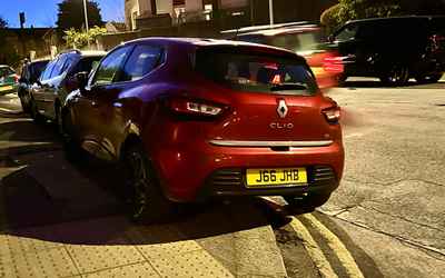 J66 JHB, a Red Renault Clio parked in Hollingdean