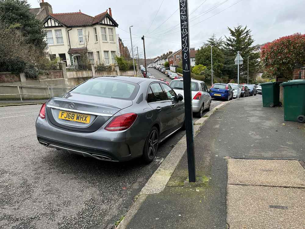 Photograph of FJ68 WHX - a Grey Mercedes C Class parked in Hollingdean by a non-resident. The third of twenty-eight photographs supplied by the residents of Hollingdean.