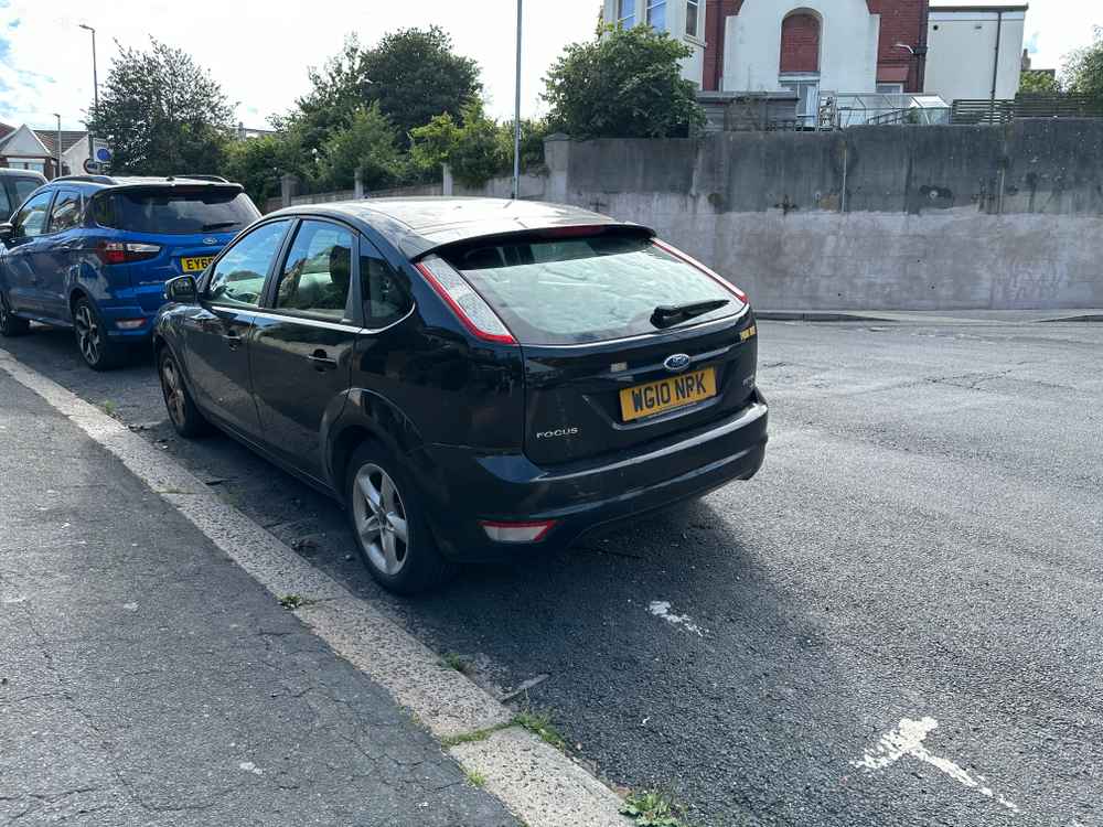 Photograph of WG10 NPK - a Black Ford Focus parked in Hollingdean by a non-resident. The second of three photographs supplied by the residents of Hollingdean.