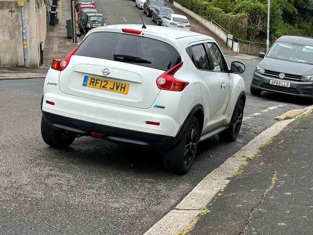 Photograph of RF12 JVH - a White Nissan Juke parked in Hollingdean by a non-resident who uses the local area as part of their Brighton commute. The eighth of twenty-five photographs supplied by the residents of Hollingdean.