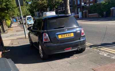X13 KAD, a Black Mini Cooper parked in Hollingdean