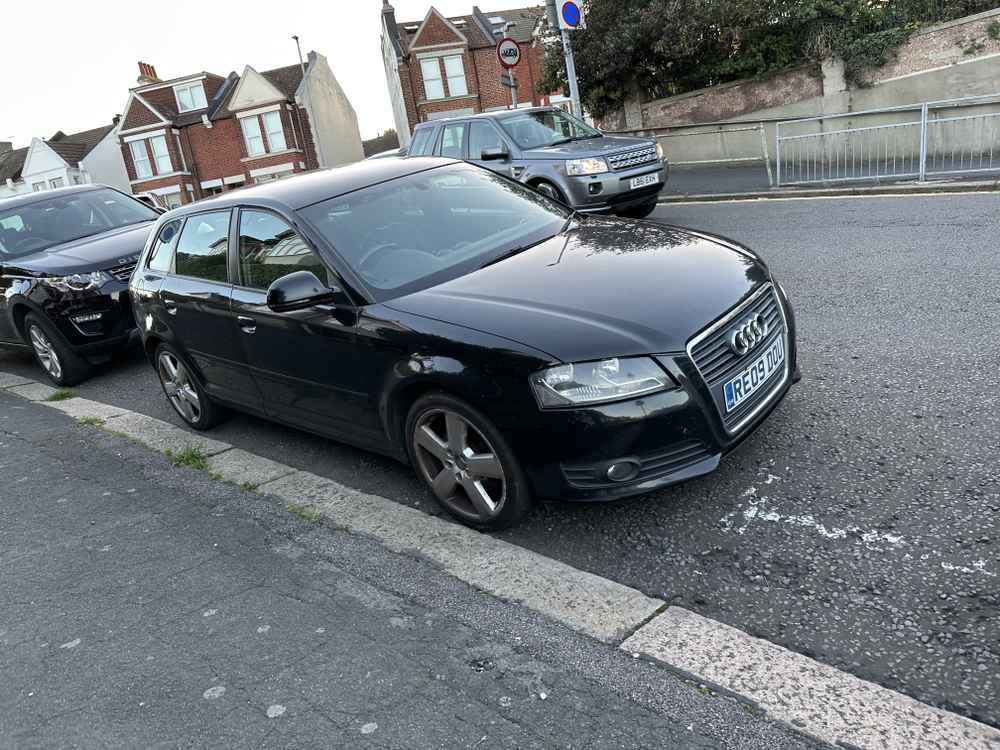 Photograph of RE09 DOU - a Black Audi A3 parked in Hollingdean by a non-resident who uses the local area as part of their Brighton commute. The second of eight photographs supplied by the residents of Hollingdean.