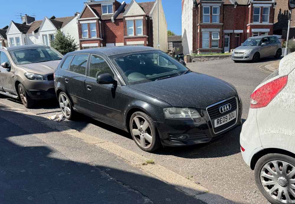 Photograph of RE09 DOU - a Black Audi A3 parked in Hollingdean by a non-resident who uses the local area as part of their Brighton commute. The tenth of ten photographs supplied by the residents of Hollingdean.