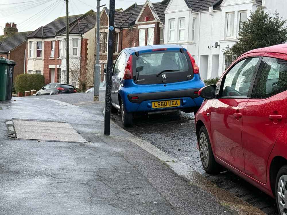 Photograph of LS60 UCA - a Blue Peugeot 107 parked in Hollingdean by a non-resident. The eighteenth of nineteen photographs supplied by the residents of Hollingdean.