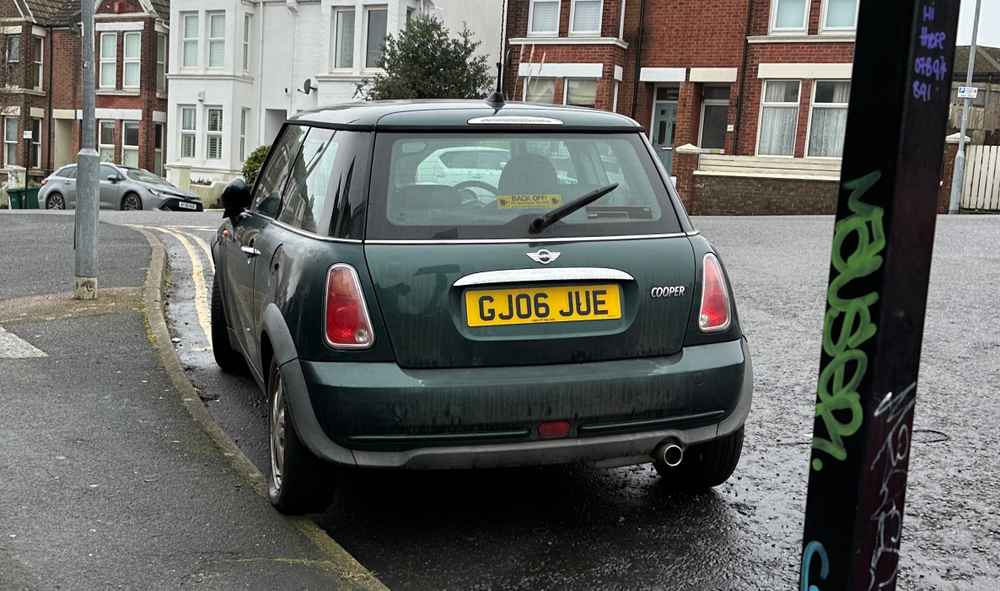 Photograph of GJ06 JUE - a Green Mini Cooper parked in Hollingdean by a non-resident. The seventh of fourteen photographs supplied by the residents of Hollingdean.