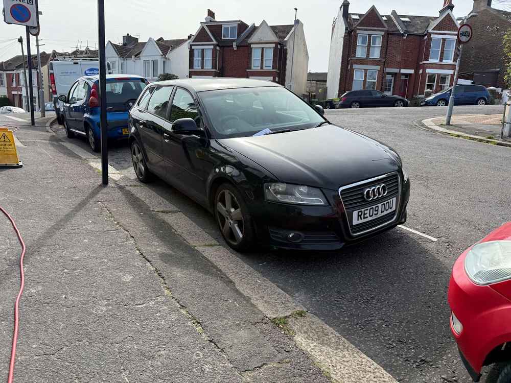 Photograph of RE09 DOU - a Black Audi A3 parked in Hollingdean by a non-resident who uses the local area as part of their Brighton commute. The twelfth of twelve photographs supplied by the residents of Hollingdean.