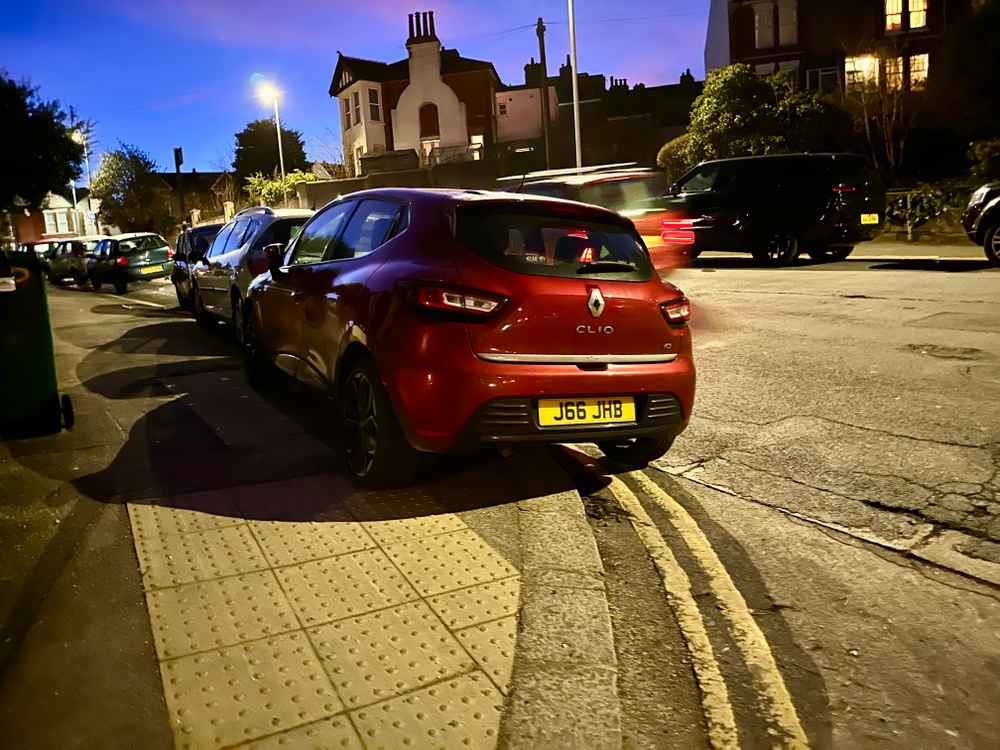 Photograph of J66 JHB - a Red Renault Clio parked in Hollingdean by a non-resident. 