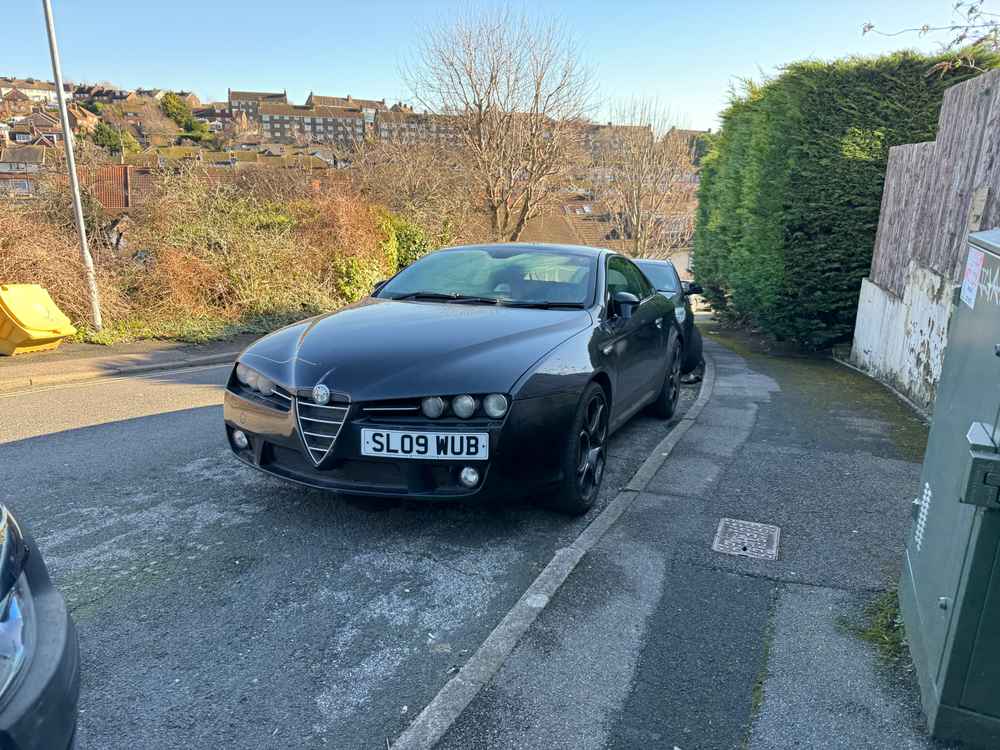 Photograph of SL09 WUB - a Black Alfa Romeo Brera parked in Hollingdean by a non-resident. The twenty-eighth of thirty-two photographs supplied by the residents of Hollingdean.