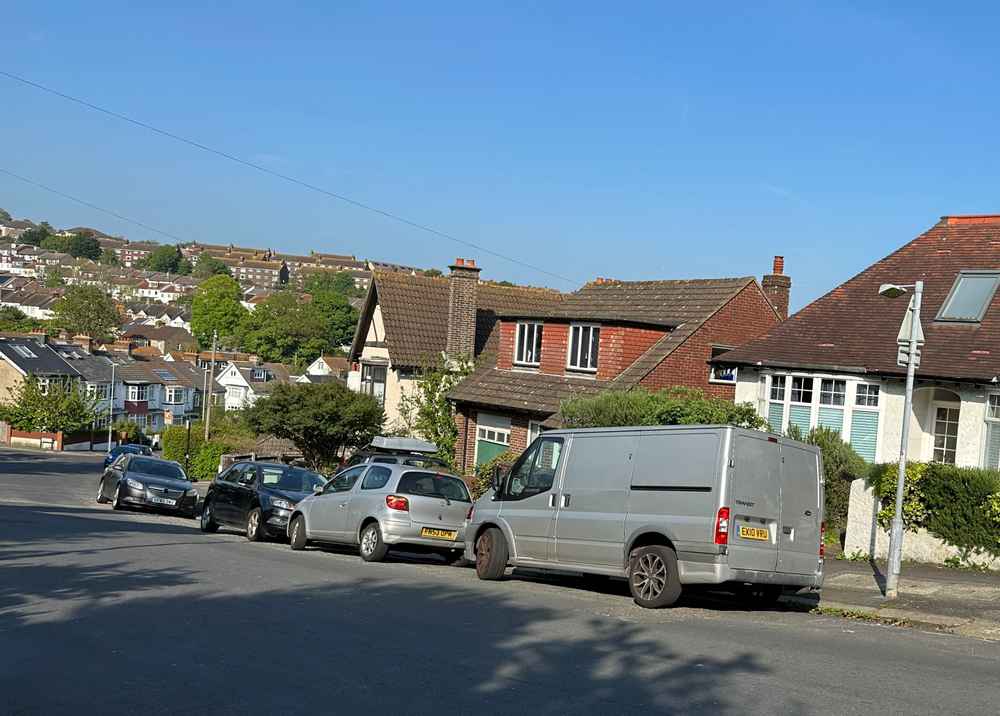 Photograph of EX10 VRU - a Silver Ford Transit parked in Hollingdean by a non-resident. The thirteenth of sixteen photographs supplied by the residents of Hollingdean.
