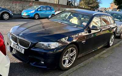 HF14 FZV, a Black BMW 5 Series parked in Hollingdean