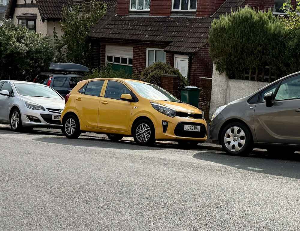 Photograph of LD73 BNU - a Yellow Kia Picanto parked in Hollingdean by a non-resident. The seventh of twelve photographs supplied by the residents of Hollingdean.