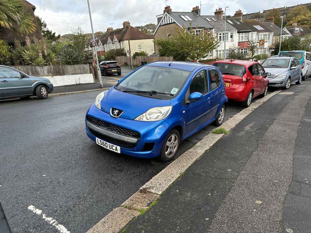 Photograph of LS60 UCA - a Blue Peugeot 107 parked in Hollingdean by a non-resident. The third of thirteen photographs supplied by the residents of Hollingdean.