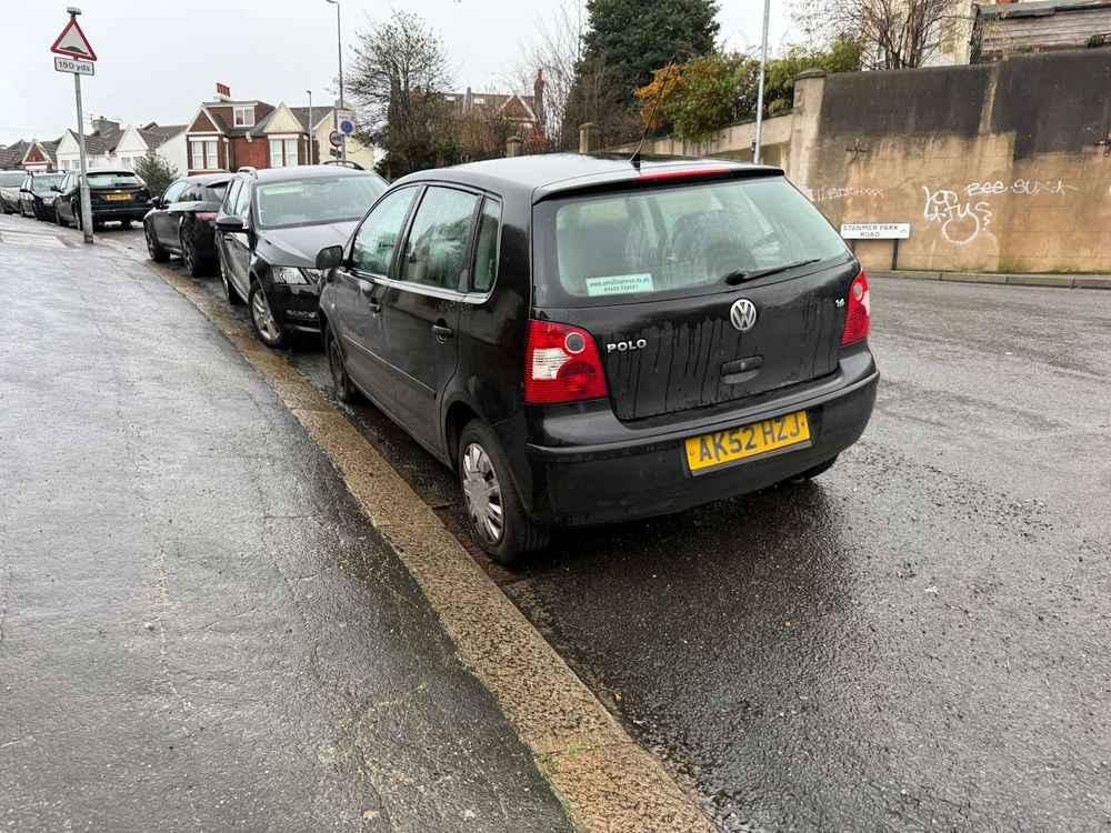 Photograph of AK52 HZJ - a Black Volkswagen Polo parked in Hollingdean by a non-resident, and potentially abandoned. The fourth of four photographs supplied by the residents of Hollingdean.