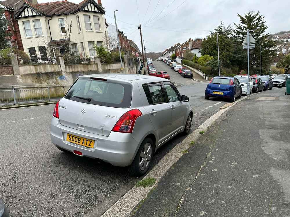 Photograph of SD08 ATZ - a Silver Suzuki Swift parked in Hollingdean by a non-resident. 