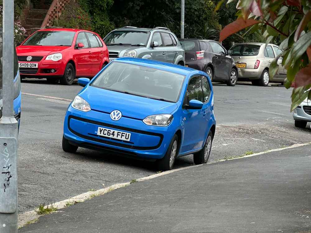 Photograph of YC64 FUU - a Blue VOlkswagen Up parked in Hollingdean by a non-resident. The second of seven photographs supplied by the residents of Hollingdean.