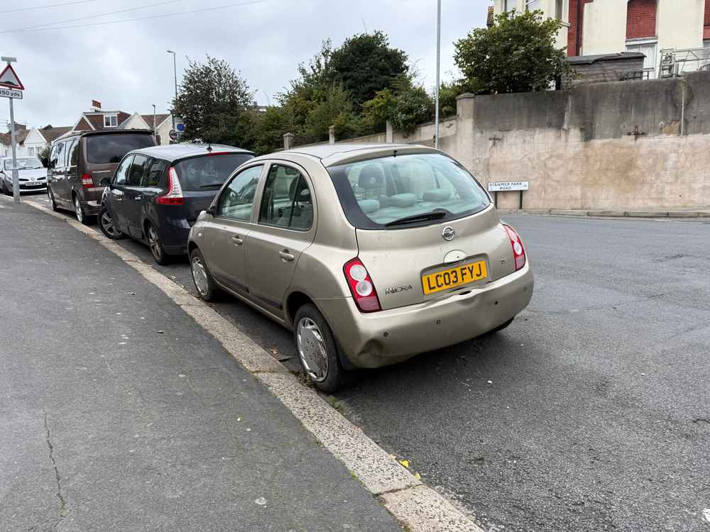 Photograph of LC03 FYJ - a Gold Nissan Micra parked in Hollingdean by a non-resident, and potentially abandoned. The twenty-first of twenty-seven photographs supplied by the residents of Hollingdean.