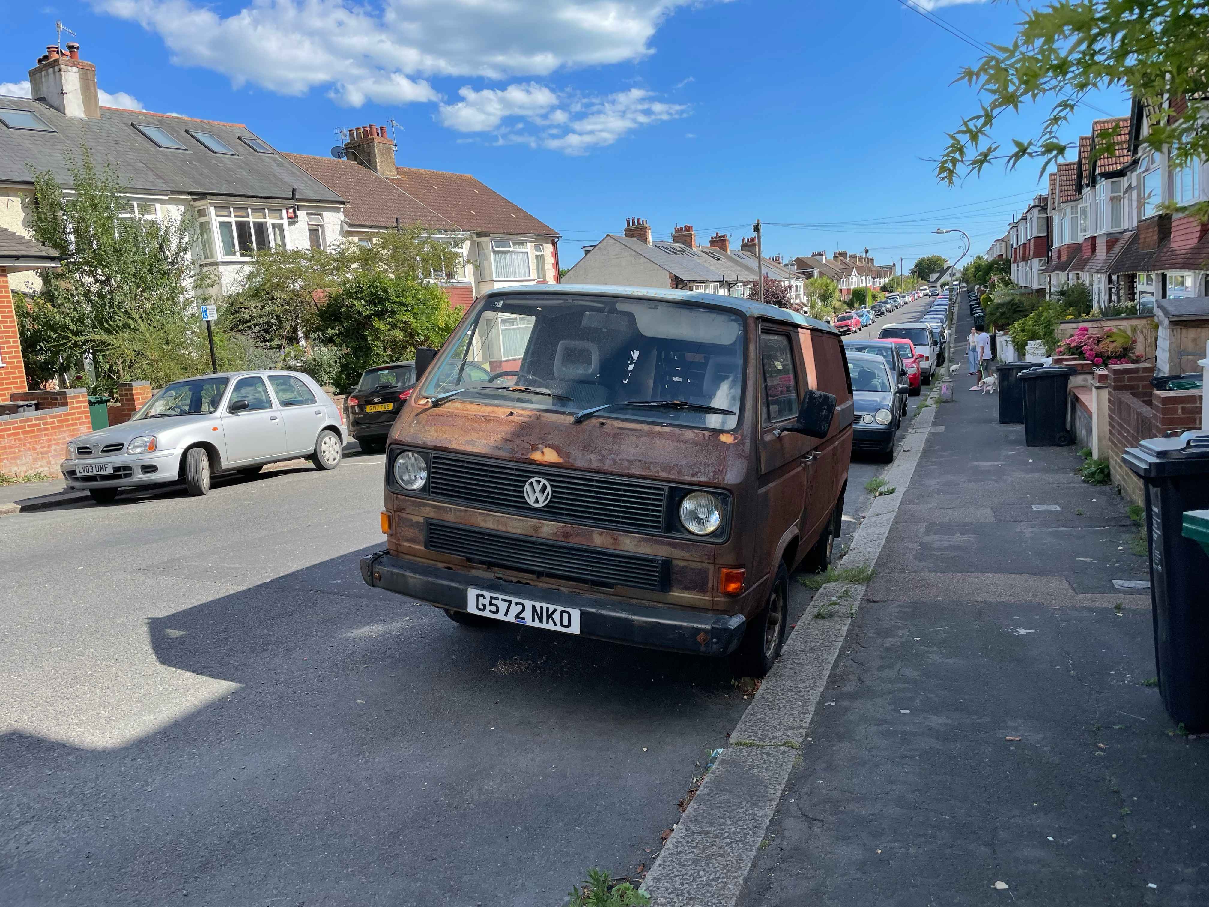 Photograph of G572 NKO - a Rusty Volkswagen Transporter camper van parked in Hollingdean by a non-resident. The first of two photographs supplied by the residents of Hollingdean.