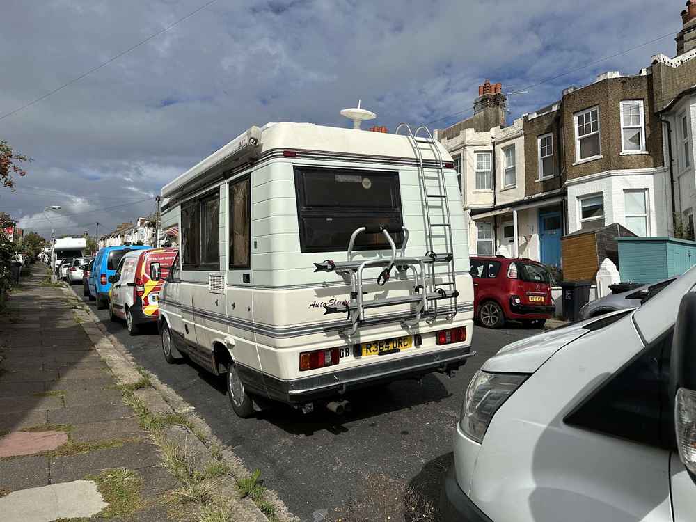 Photograph of R384 ORC - a Beige Volkswagen Transporter camper van parked in Hollingdean by a non-resident, and potentially abandoned. The sixth of fifteen photographs supplied by the residents of Hollingdean.