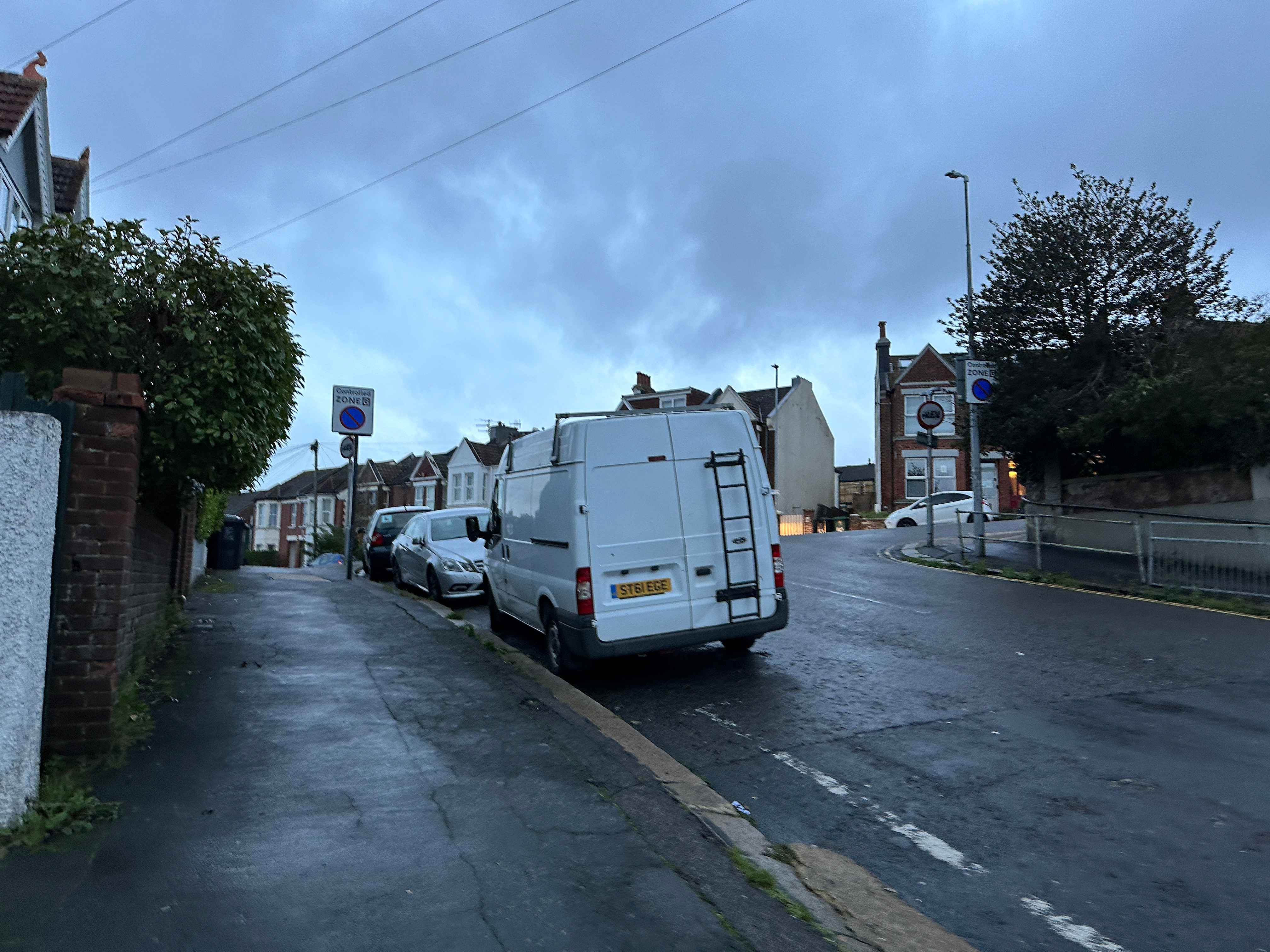 Photograph of ST61 EGE - a White Ford Transit parked in Hollingdean by a non-resident. The third of six photographs supplied by the residents of Hollingdean.
