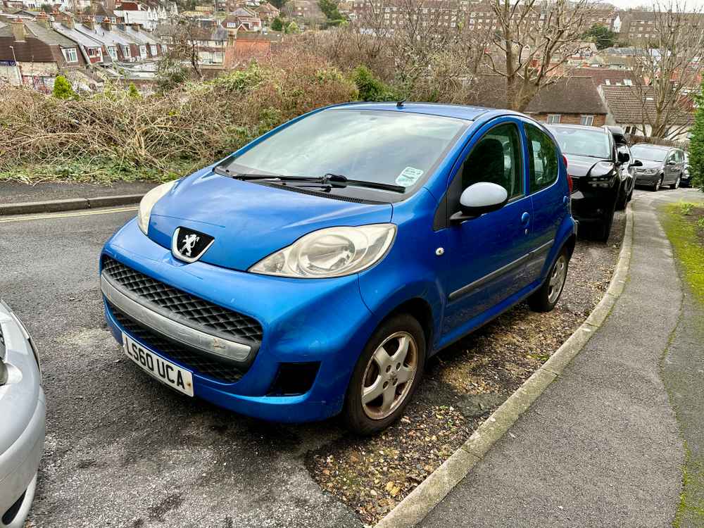 Photograph of LS60 UCA - a Blue Peugeot 107 parked in Hollingdean by a non-resident. The seventh of thirteen photographs supplied by the residents of Hollingdean.