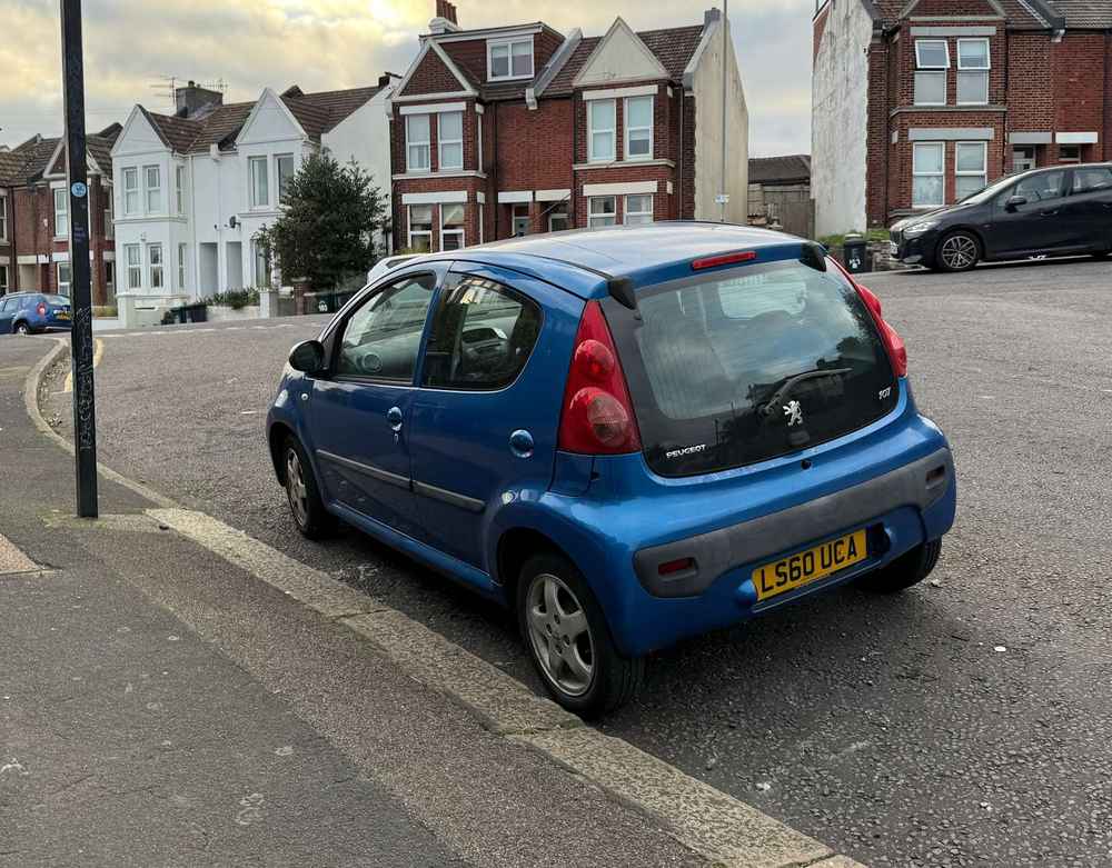 Photograph of LS60 UCA - a Blue Peugeot 107 parked in Hollingdean by a non-resident. The fifteenth of thirty photographs supplied by the residents of Hollingdean.