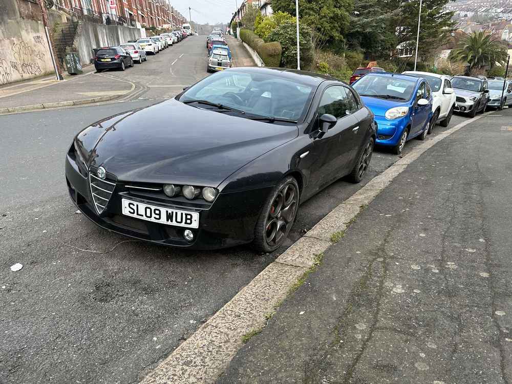 Photograph of SL09 WUB - a Black Alfa Romeo Brera parked in Hollingdean by a non-resident. The seventeenth of forty-four photographs supplied by the residents of Hollingdean.