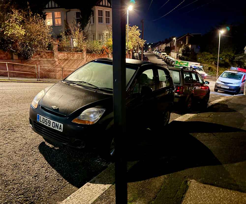 Photograph of LD59 ONA - a Black Daewoo Matiz parked in Hollingdean by a non-resident. The second of four photographs supplied by the residents of Hollingdean.