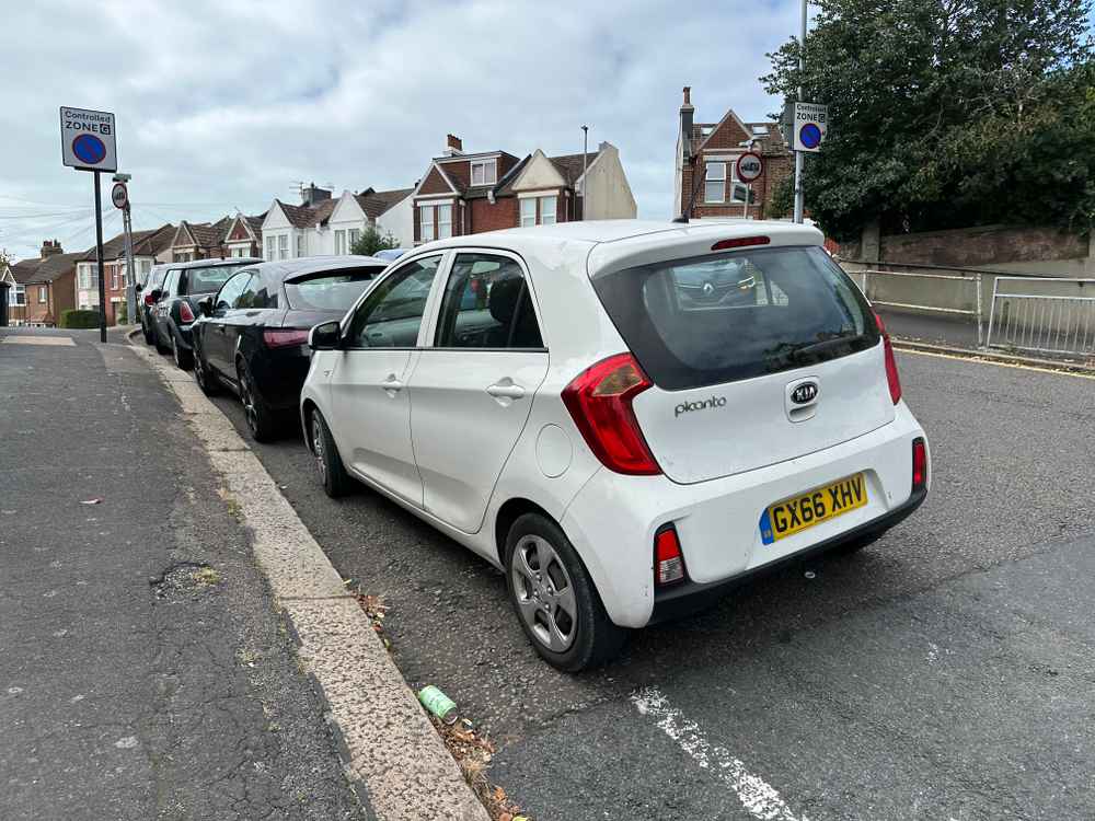 Photograph of GY66 XHV - a White Kia Picanto parked in Hollingdean by a non-resident. The third of five photographs supplied by the residents of Hollingdean.