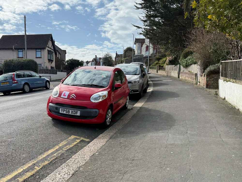Photograph of YP58 XDF - a Red Citroen C1 parked in Hollingdean by a non-resident, and potentially abandoned. The ninth of twenty photographs supplied by the residents of Hollingdean.